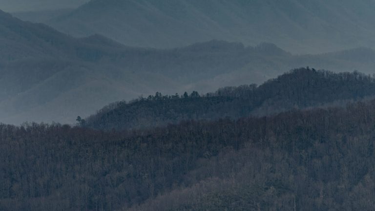 Layered mountain ridges fading into the distance at different horizons