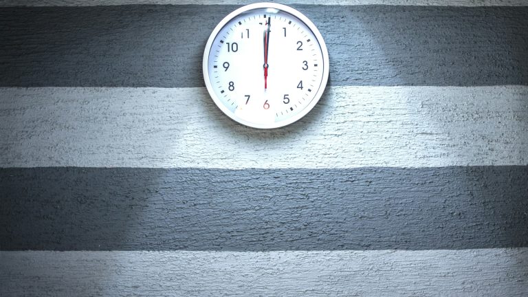 Close-up of a wall clock, illustrating how often does a trading bot trade on a fixed schedule