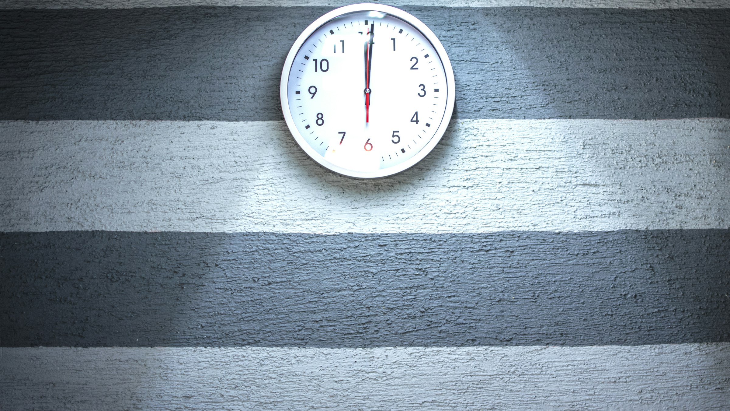 Close-up of a wall clock, illustrating how often does a trading bot trade on a fixed schedule