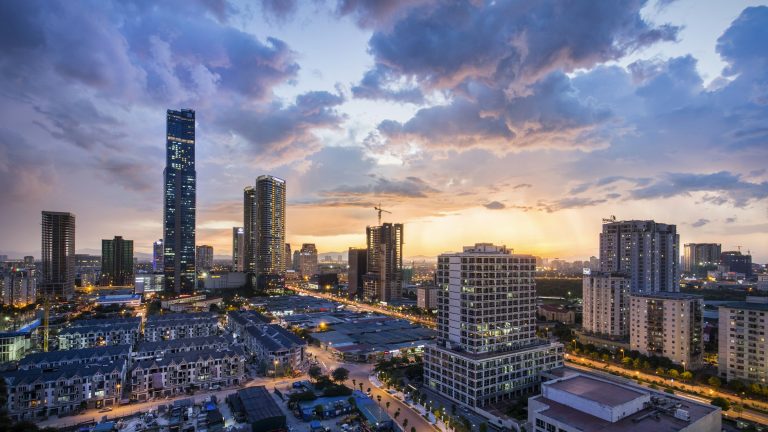 Hanoi high-rise buildings at golden hour, a view of the Vietnam crypto market's home city